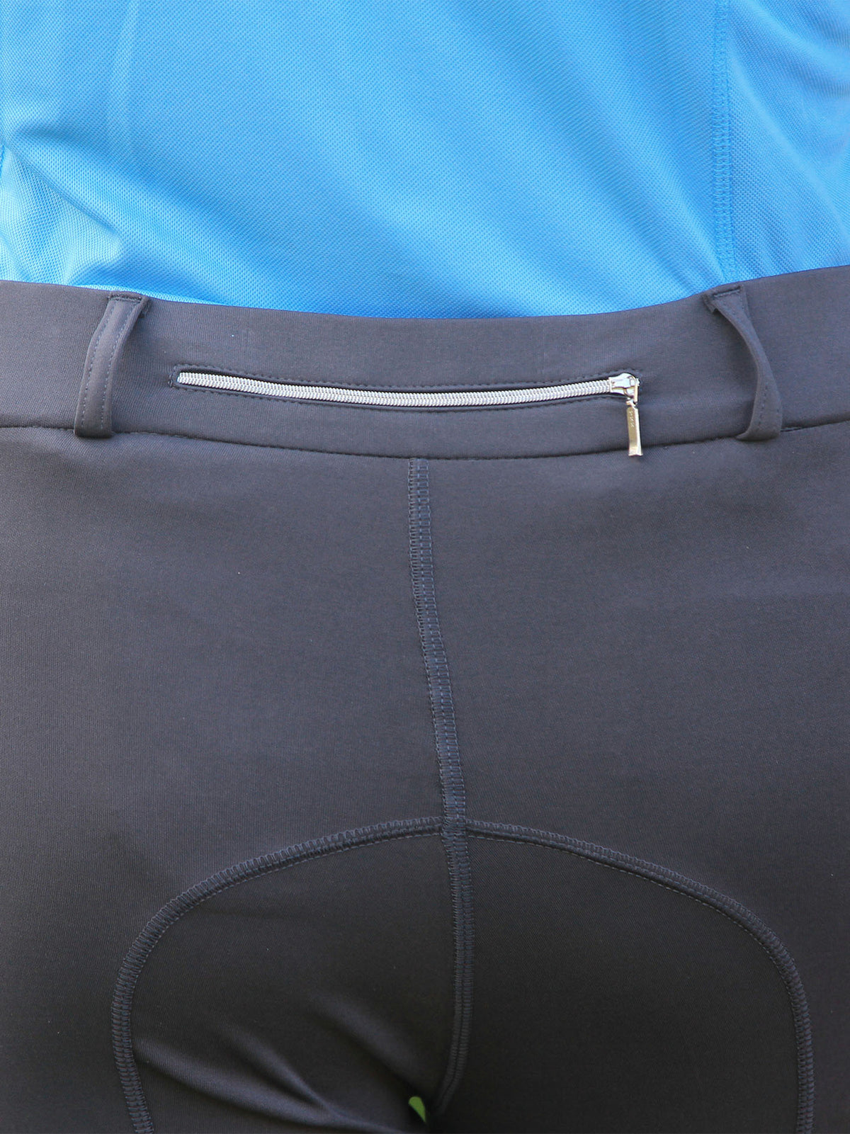Winter riding tights with zip pocket on the back, showing close up of the seat and the zip pocket.
