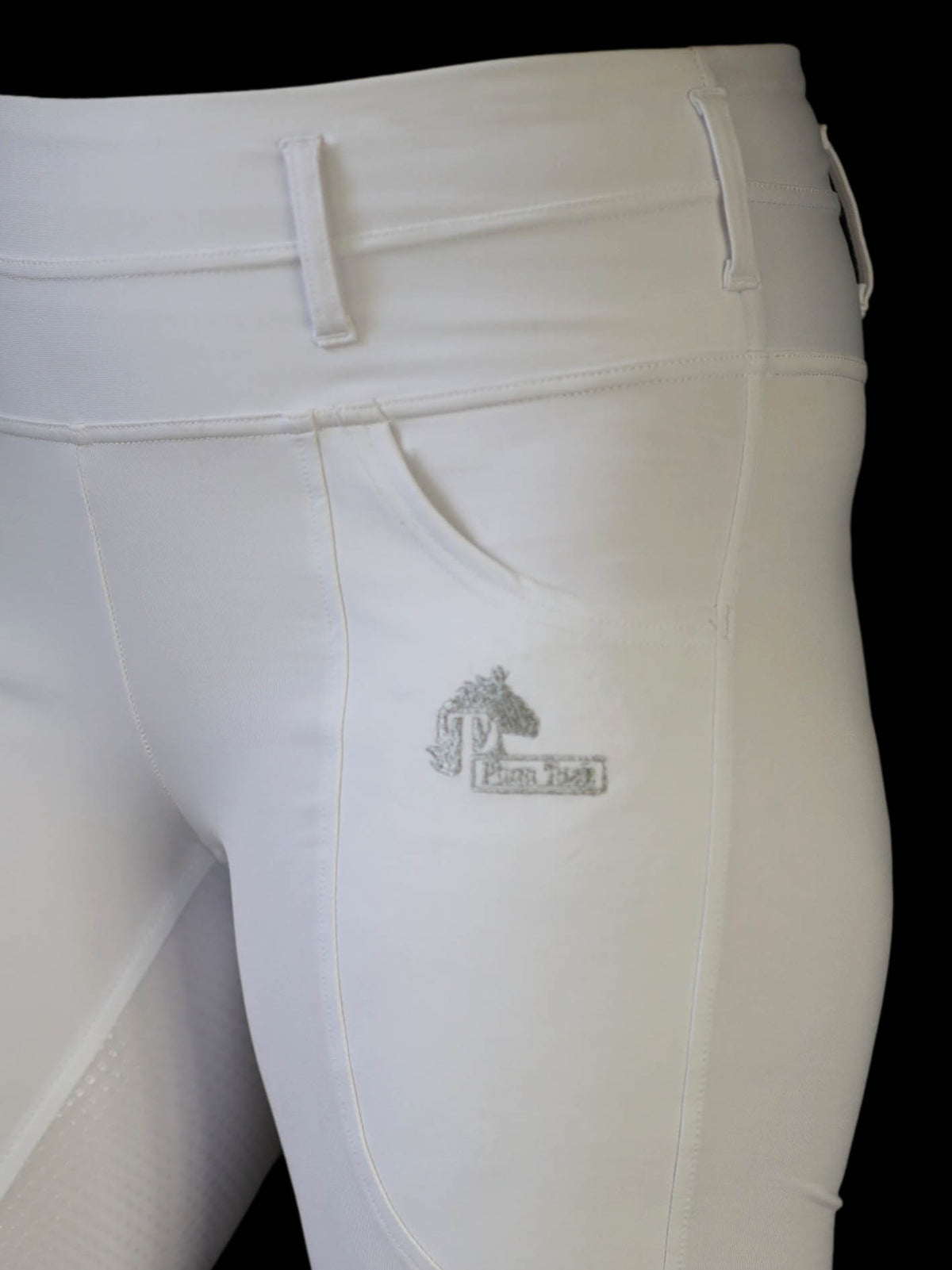 white dressage riding tights close up showing phone pocket