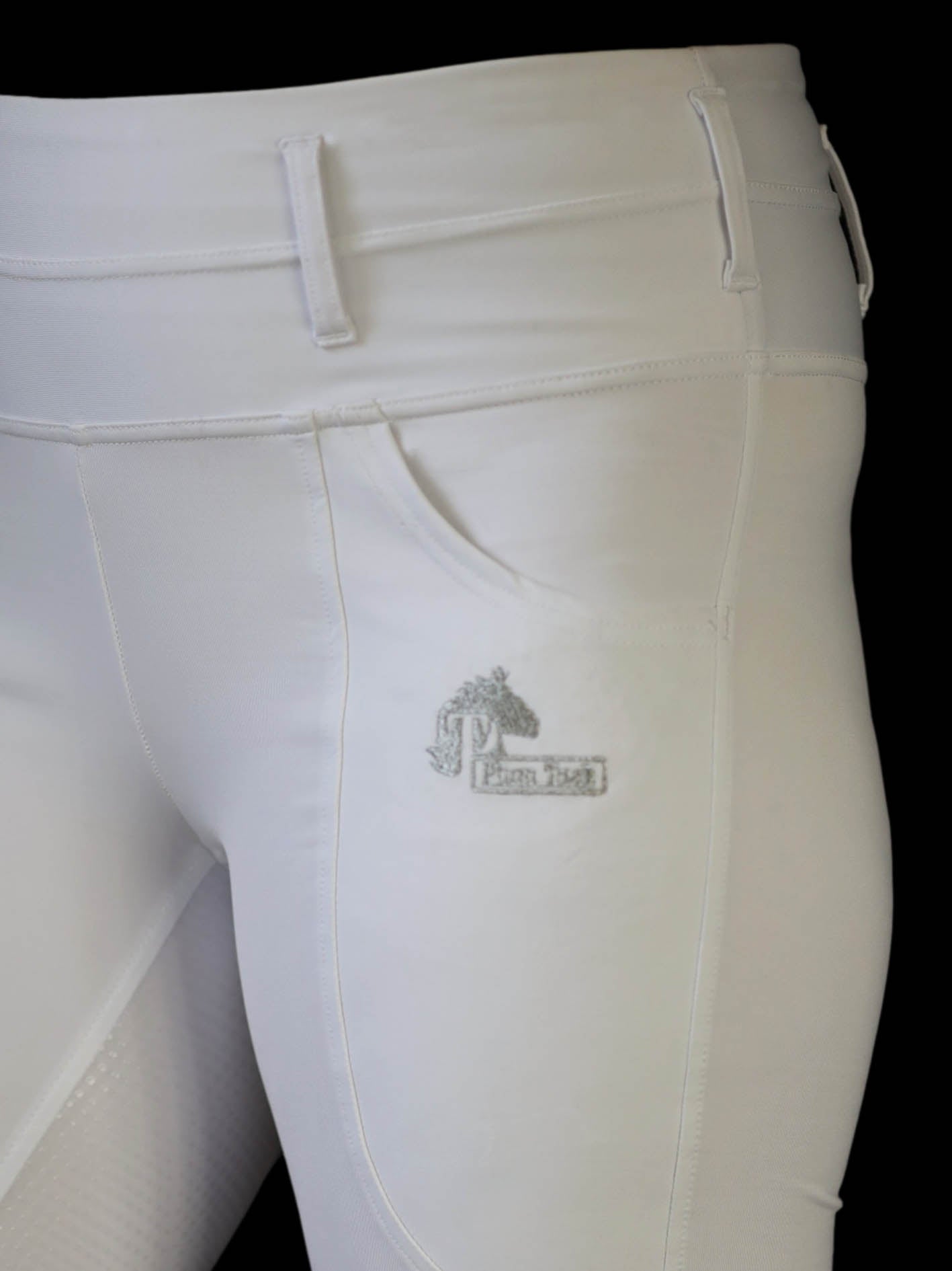 white dressage riding tights close up showing phone pocket