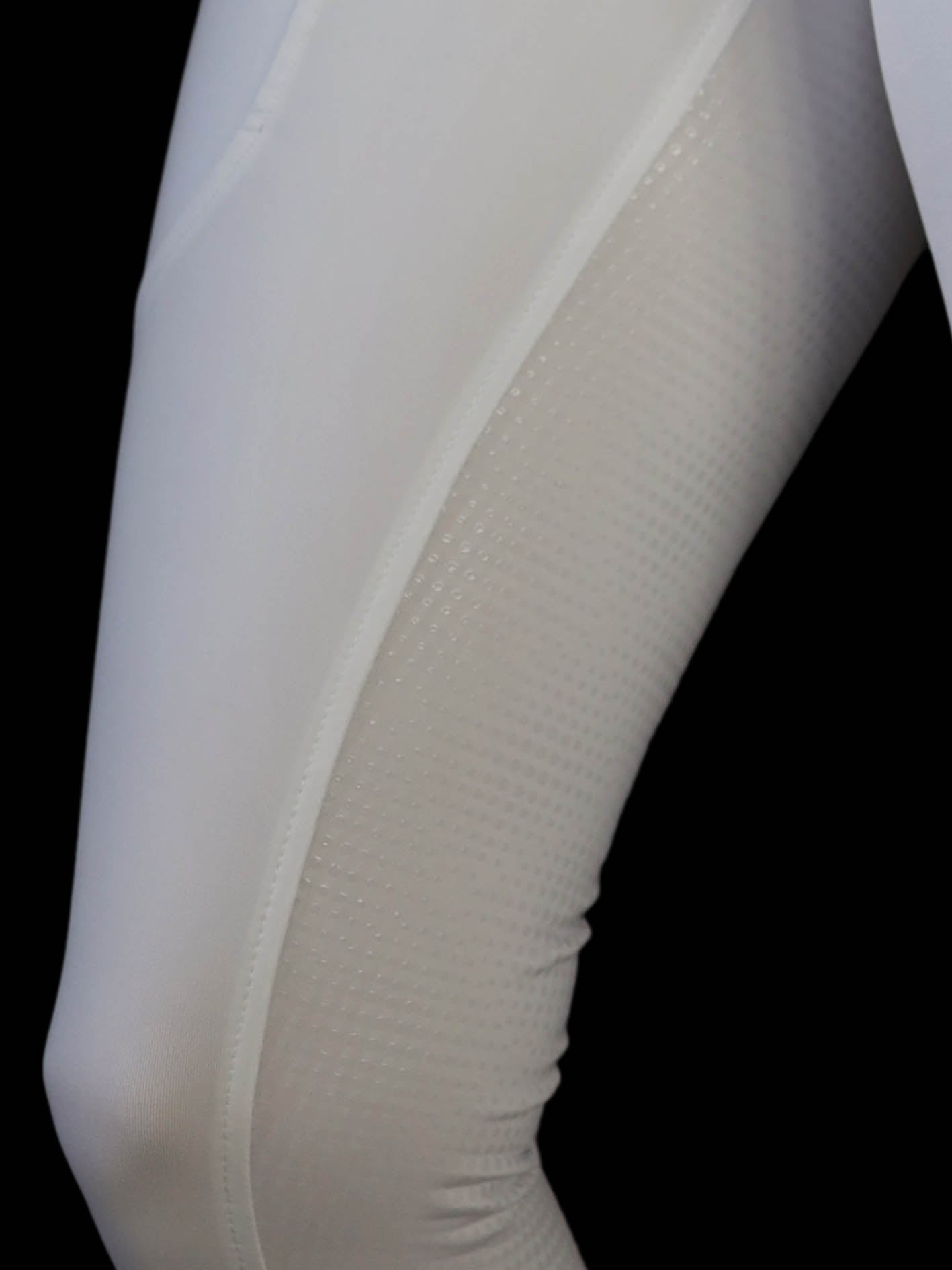 White riding tights close up showing silicone grip on inner thigh